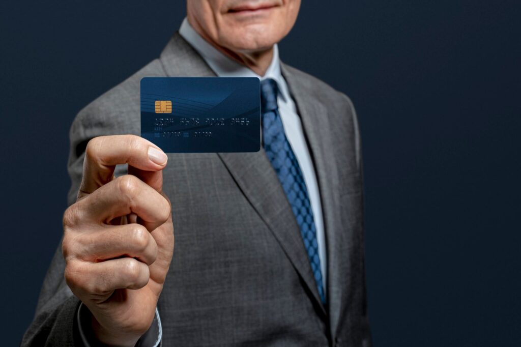 Finance | businessman-showing-credit-card2